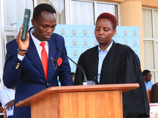 A student leader takes the oath of office at a UESA swearing-in ceremony